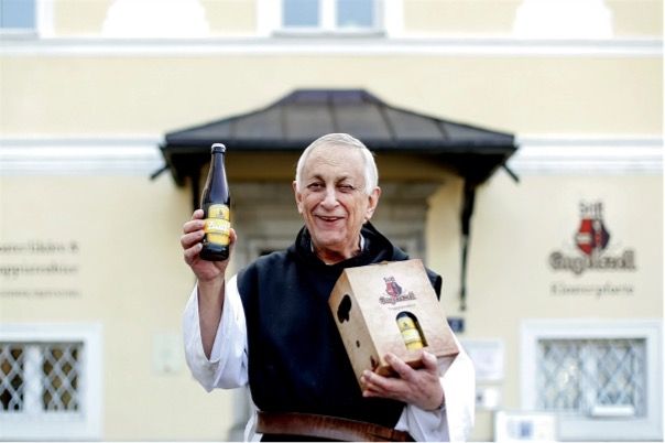 One of the monks of Engelszell Abbey proudly showing off one of their beers. © Engelszell Abbey