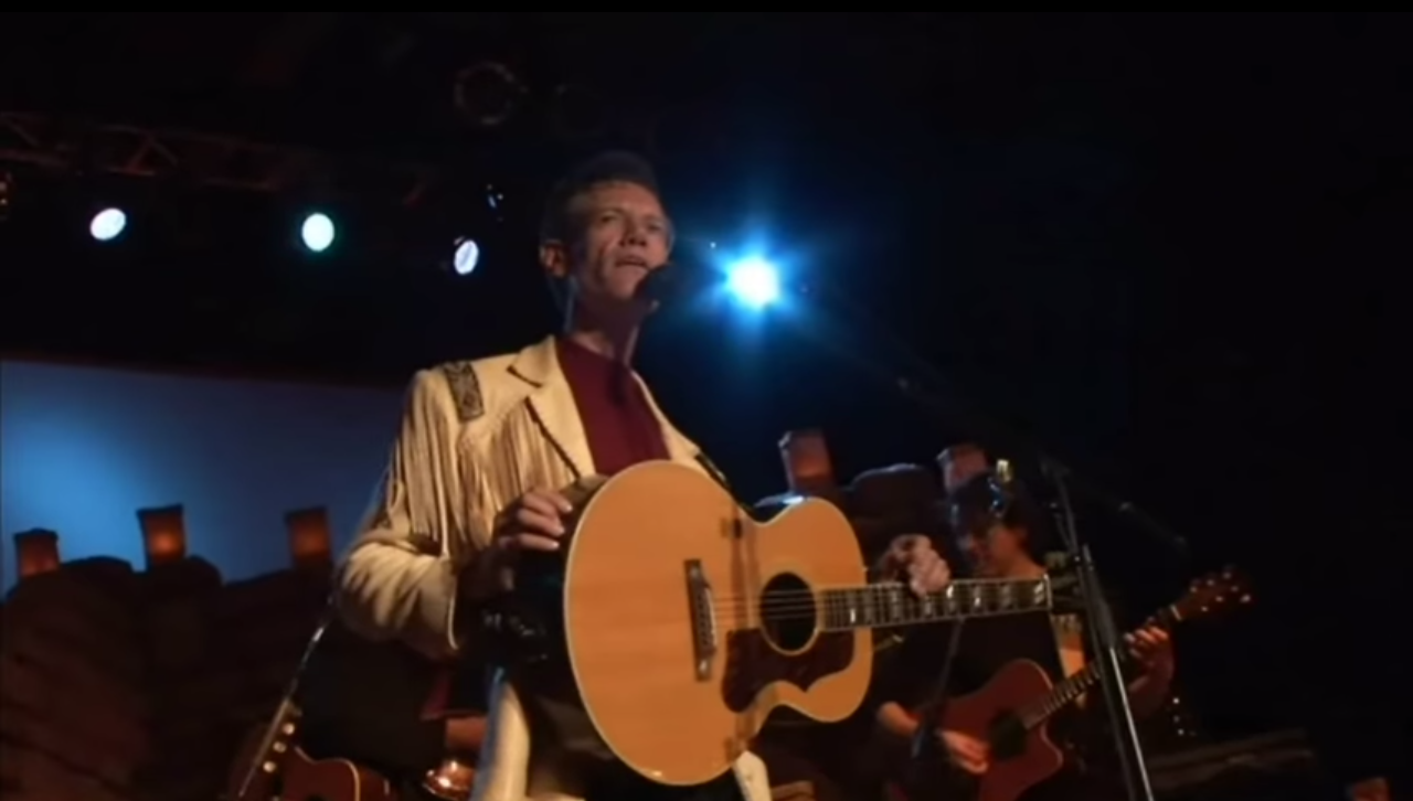 The Power of Redemption: Watch Randy Travis Perform "Three Wooden Crosses"