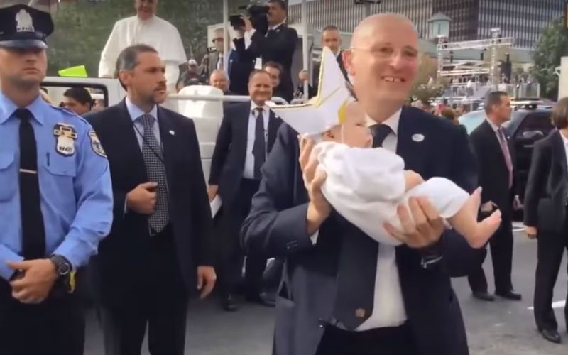 Super Cute! See Francis' Reaction to a Baby Dressed Up as the Pope