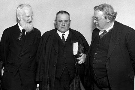 Belloc (center) with George Bernard Shaw on the left and G. K. Chesterton on the right / Wikimedia Commons