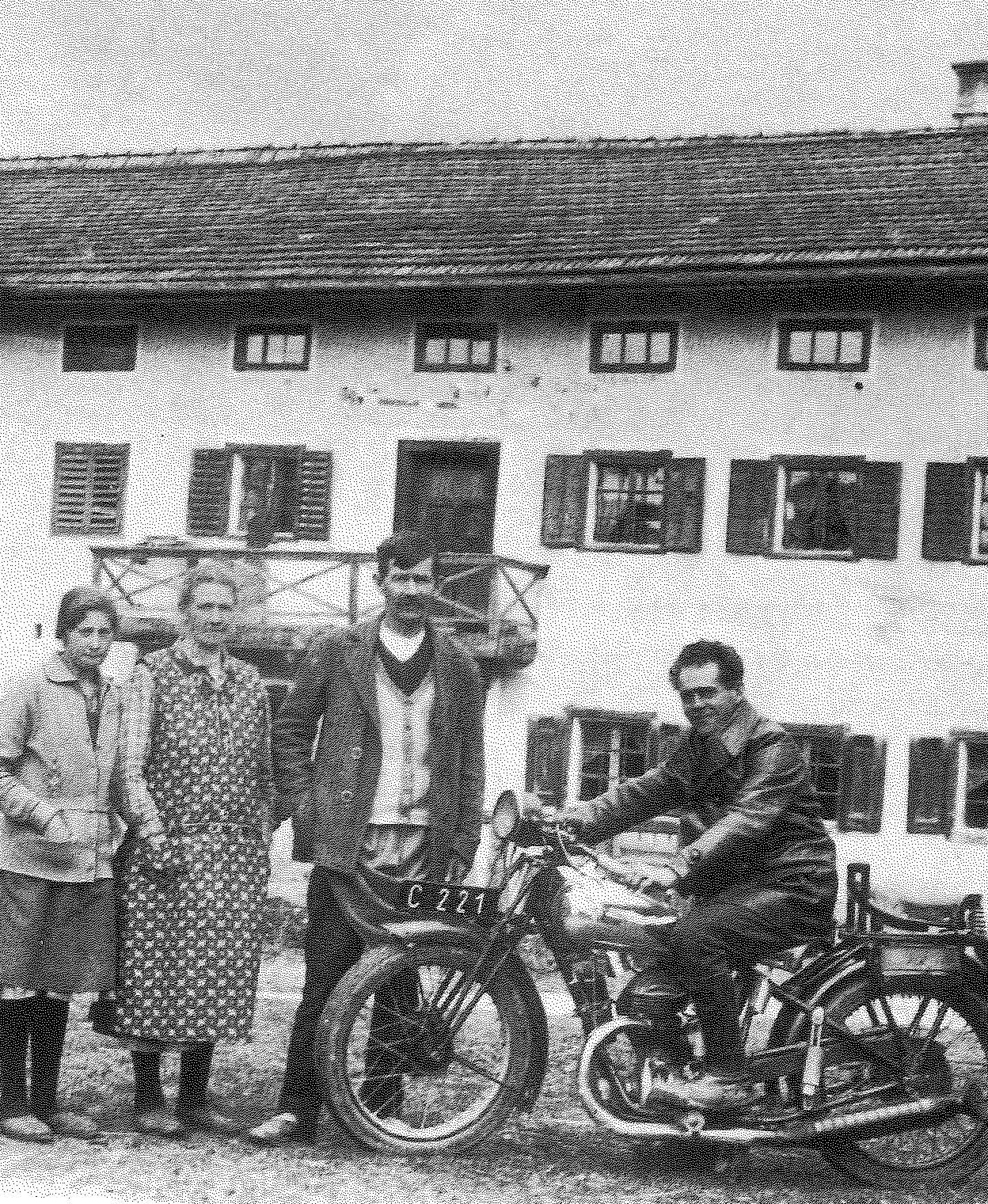 Franz Jagerstatter poses on his motorcycle. From right to left: Franz Jagerstatter; his stepfather, Heinrich Jagerstatter; his mother, Rosalia Jagerstatter; and Aloisia Sommerauer, Franz’s cousin and foster sister. /Styria Verlag. Used with permission.